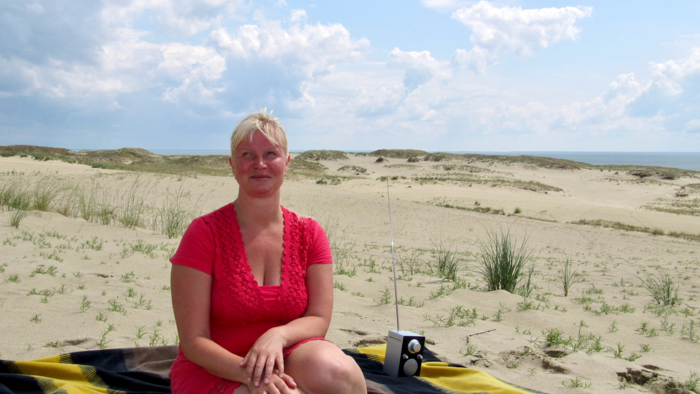 Eve on sand dune in Nida