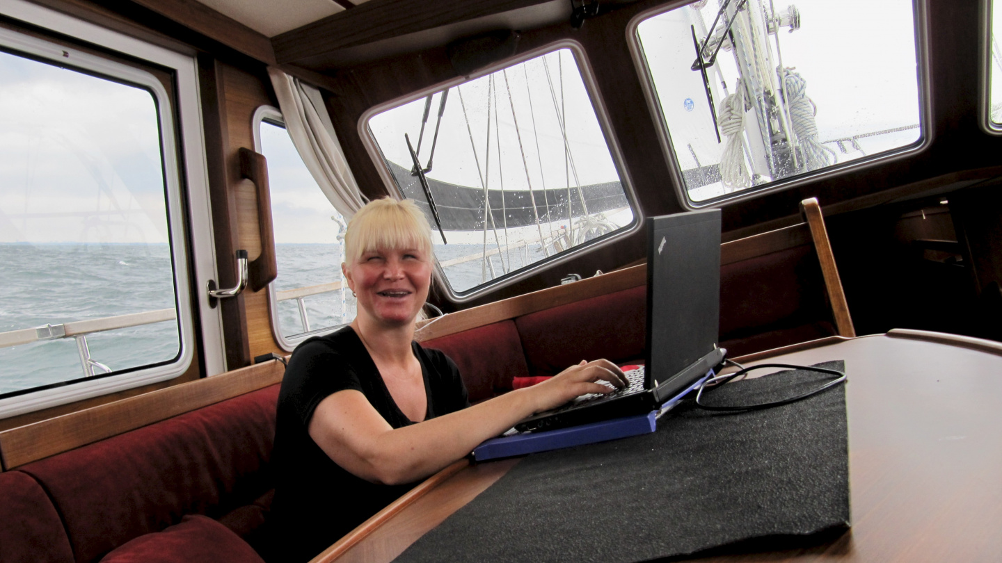 Eve updating the sailing blog on the Sound