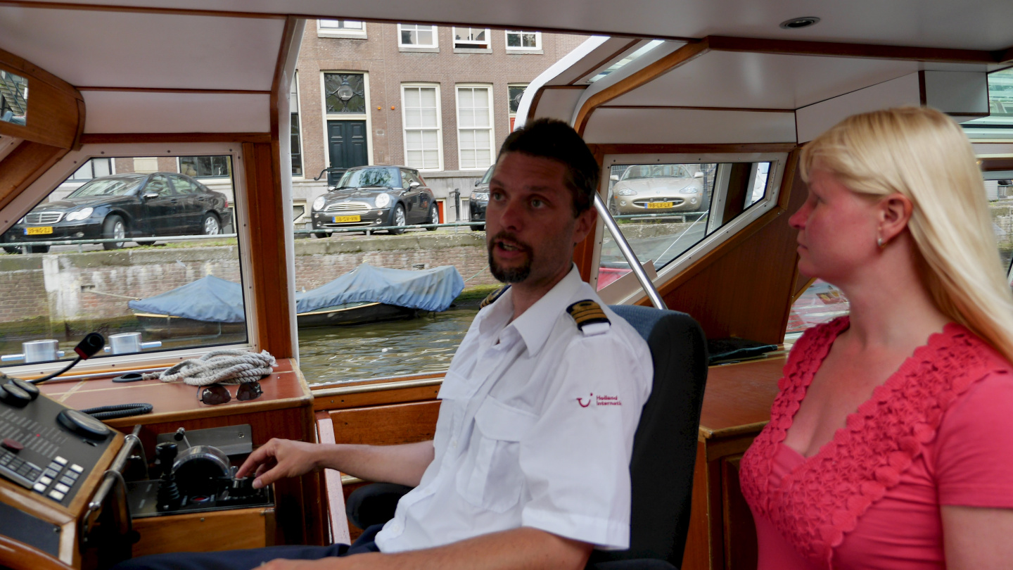 Eve chatting with the skipper of the canalboat in Amsterdam