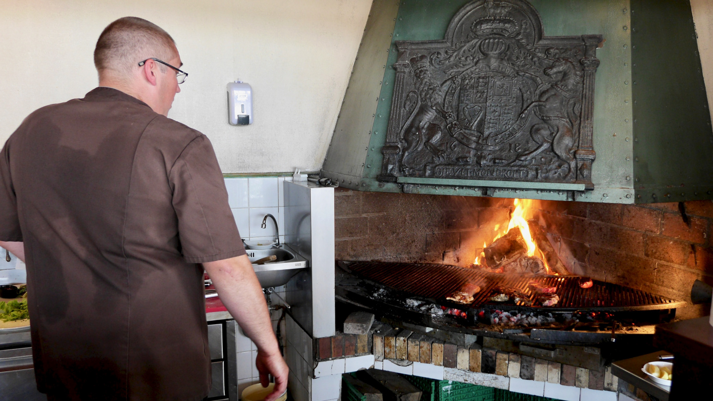 Preparing the food on open fire at Cherbourg yacht club