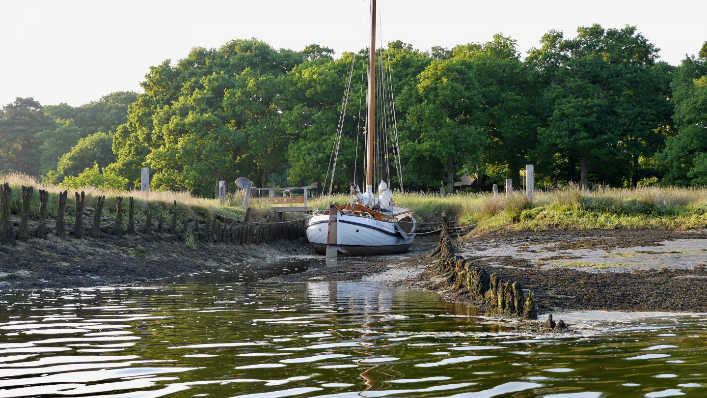 Traditional boat in a mud berth on the Beaulieu river