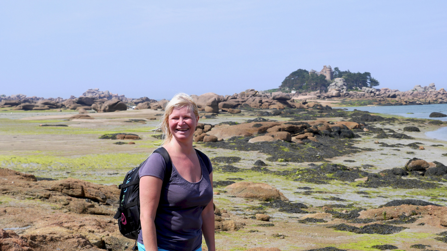 Eve on the walk at dried seabed of Ploumanac'h in Brittany