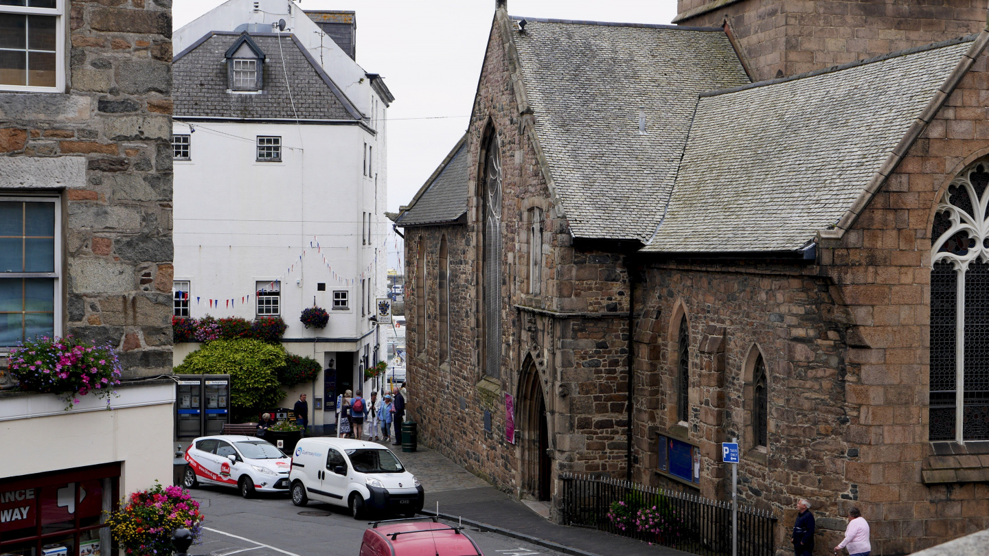 The Albion House pub next to a church in Guernsey