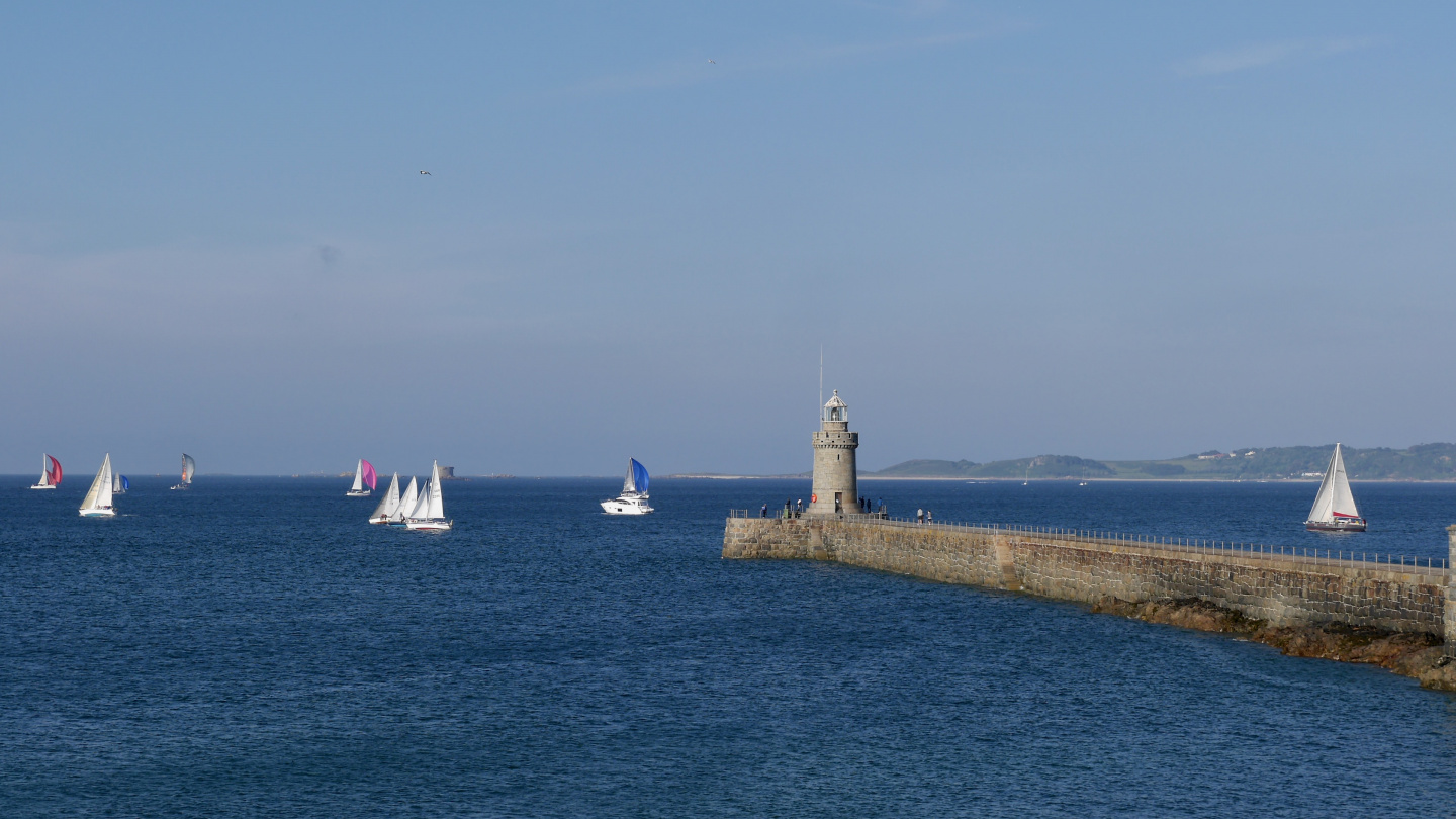 A sailing race in front of the Guernsey Yacht Club