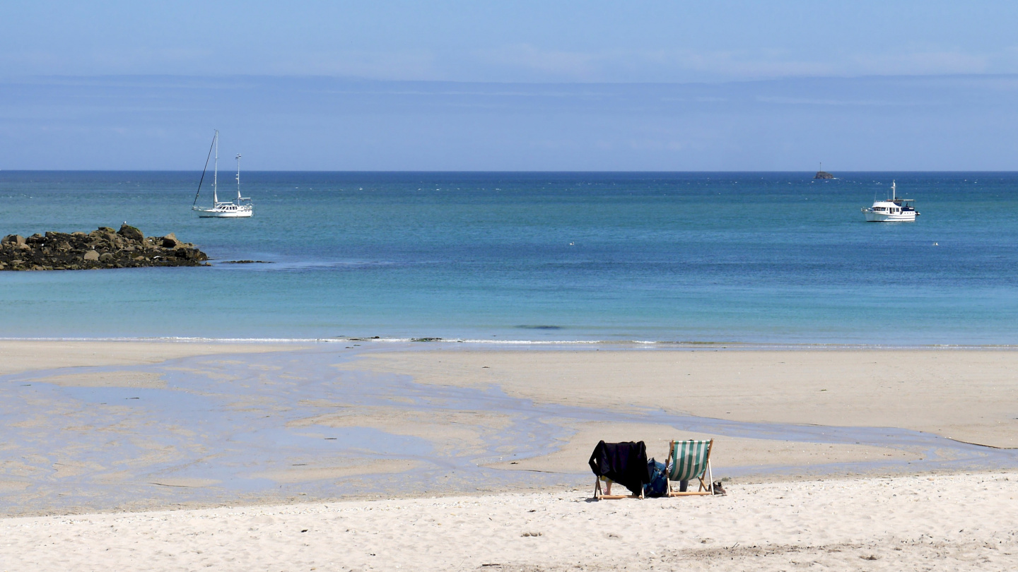 Suwena anchored at the Shell Beach Bay on the island of Herm