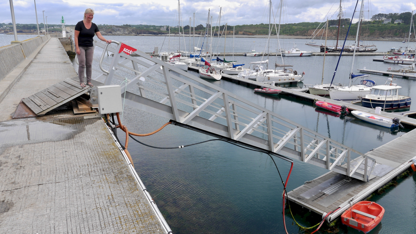 Eve on the breakwater of Camaret-sur-Mer marina in Brittany