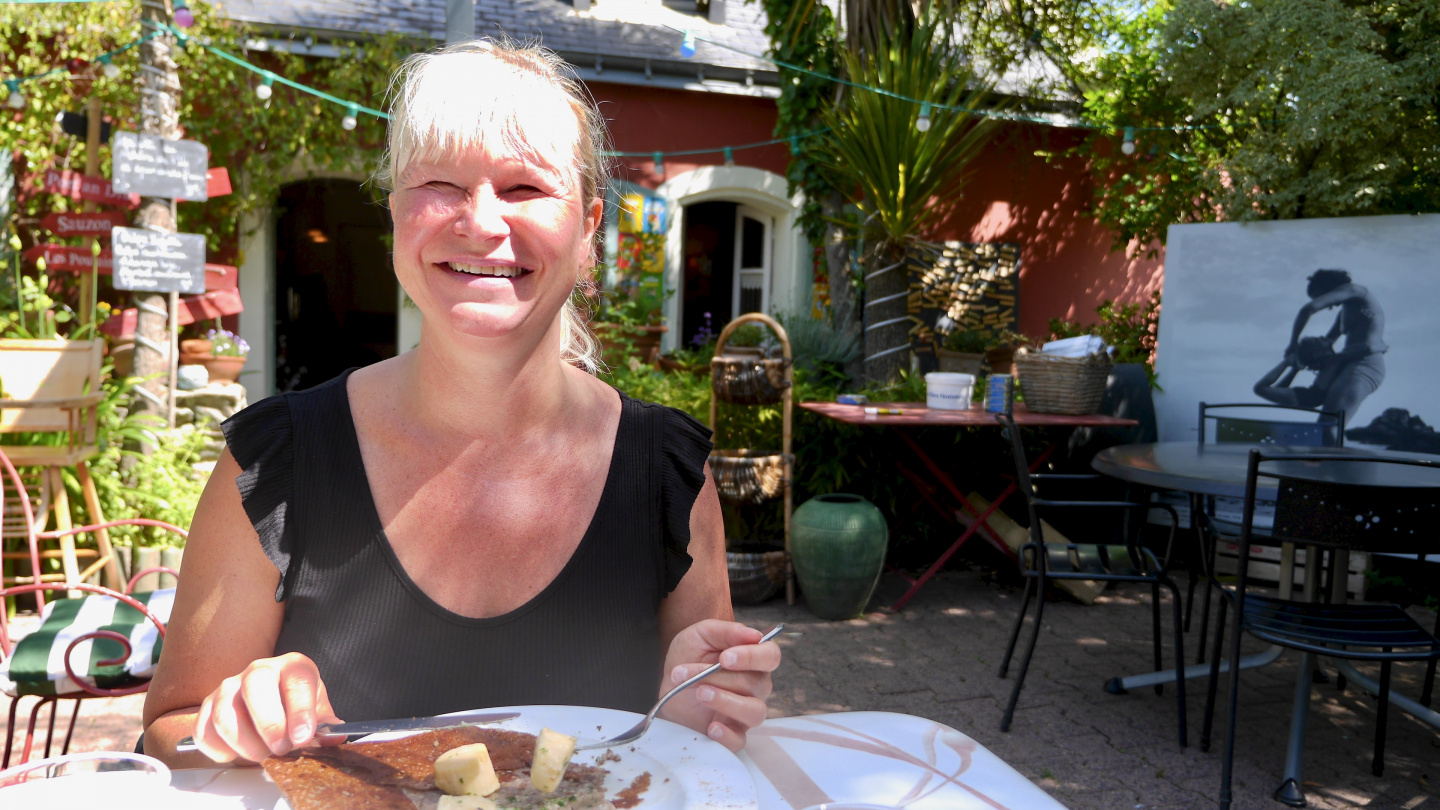 Eve having a scallop galette in Belle-Île of Brittany