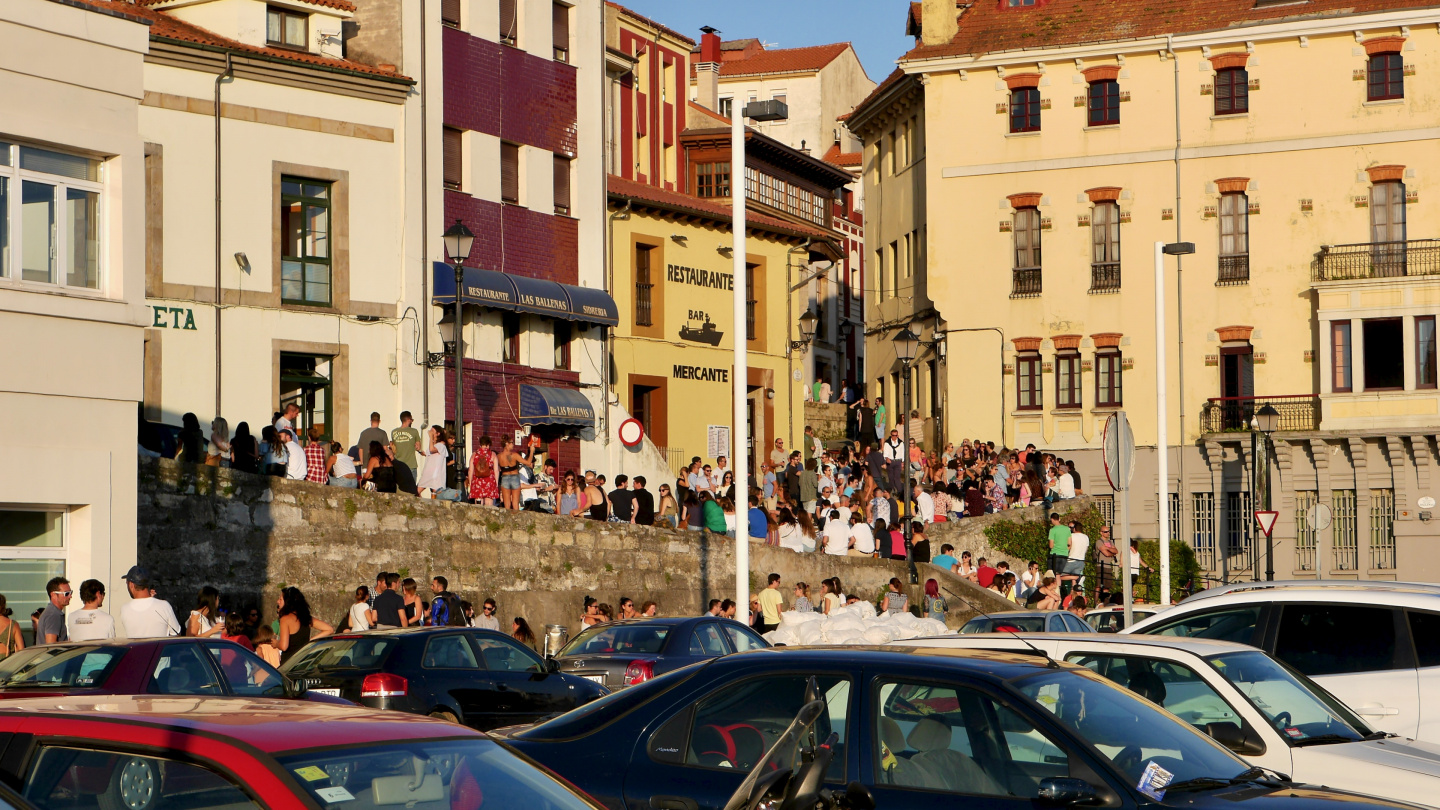 The youth partying in the waterfront of Gijon in Spain