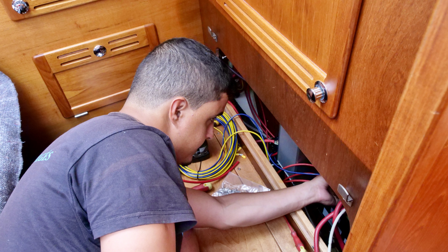 Electrician Wallace installing Furlex cables in Algés, Portugal