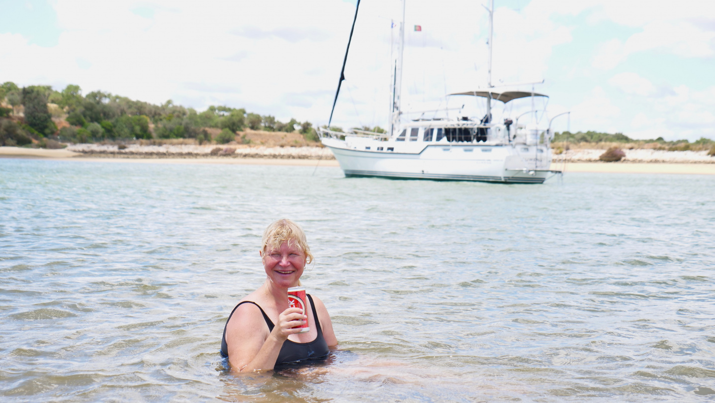 Eve having a cold one in Alvor, Portugal