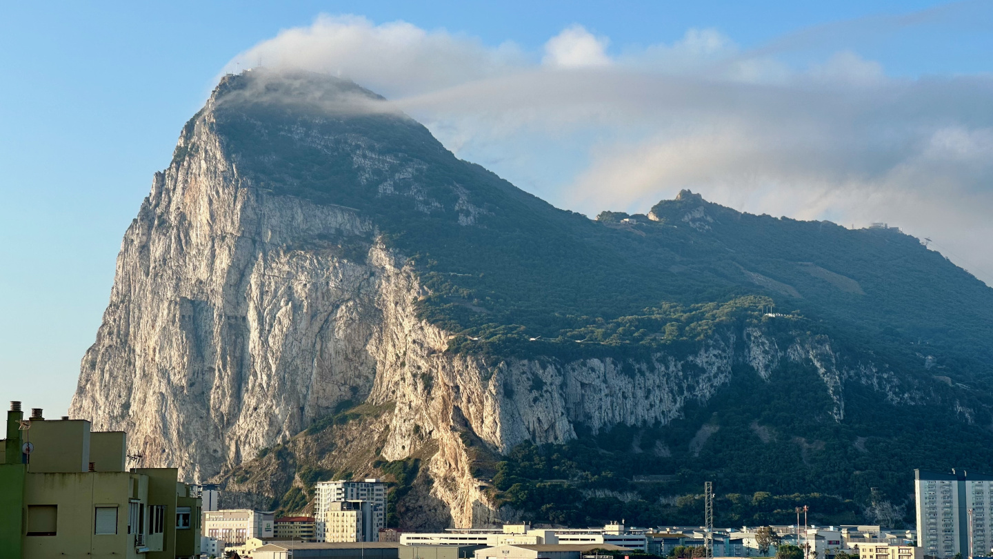 The Rock of Gibraltar wearing a hat